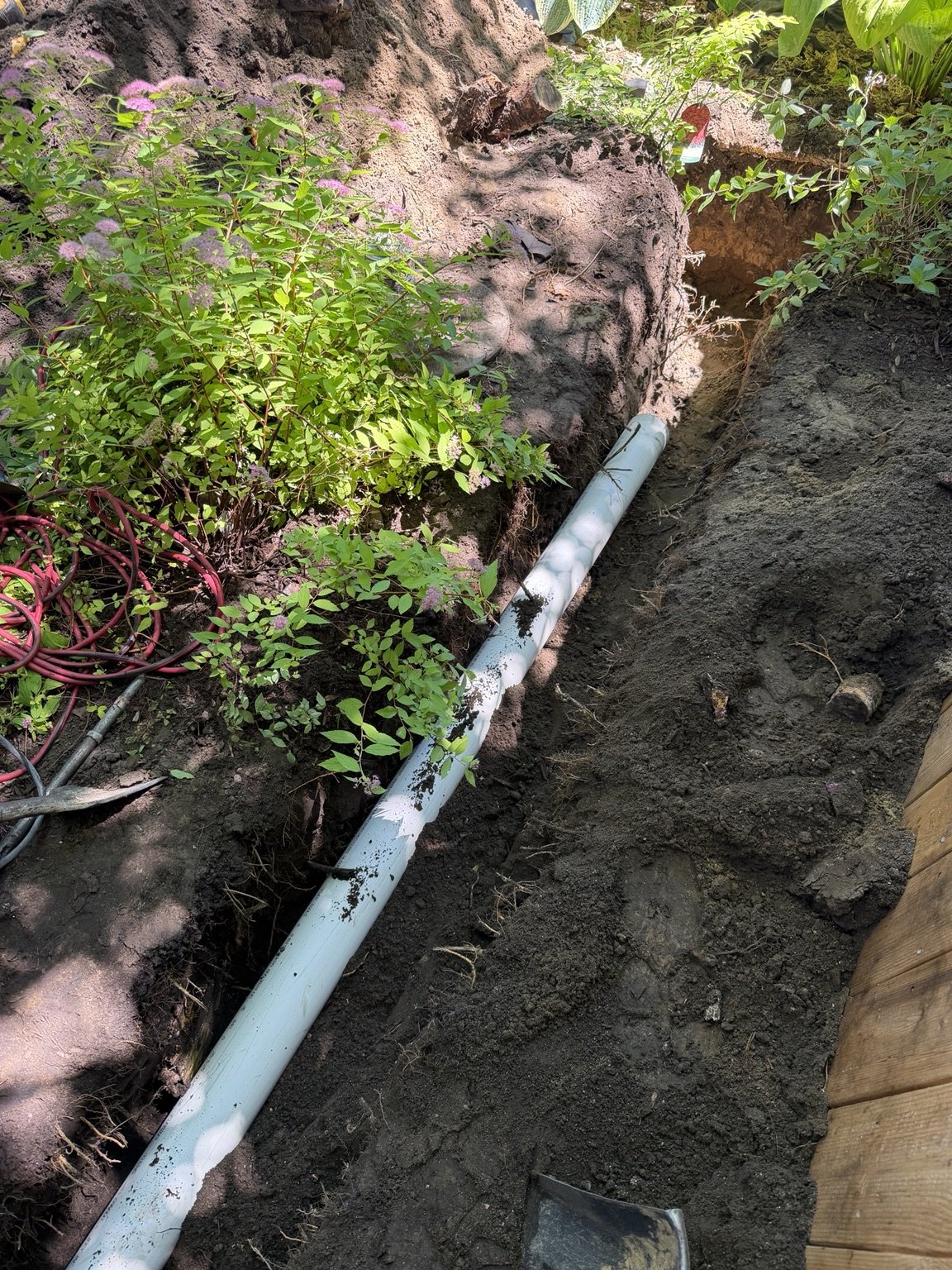 Underground pipe route beside the house