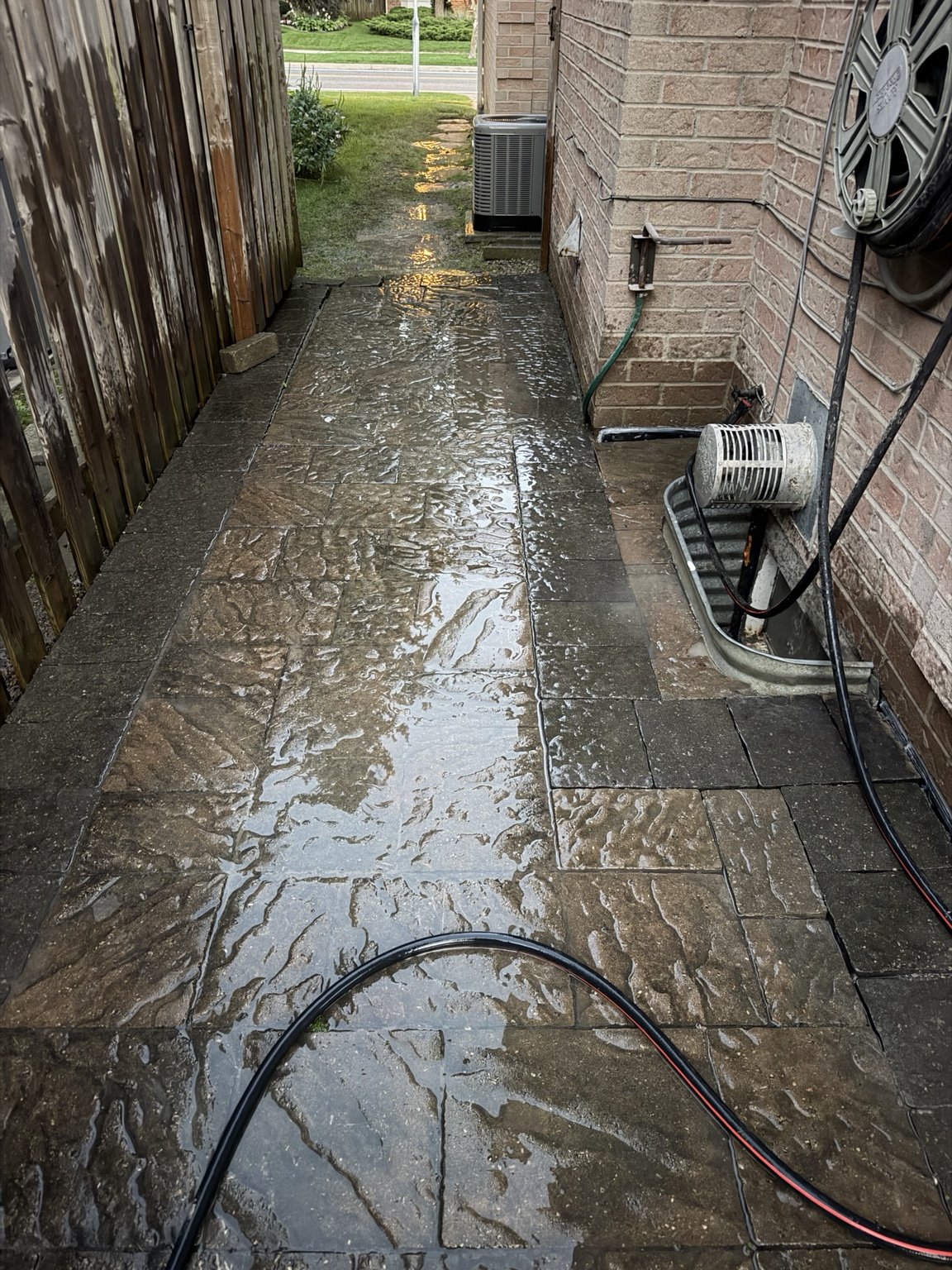 Restored paver walkway around a window well