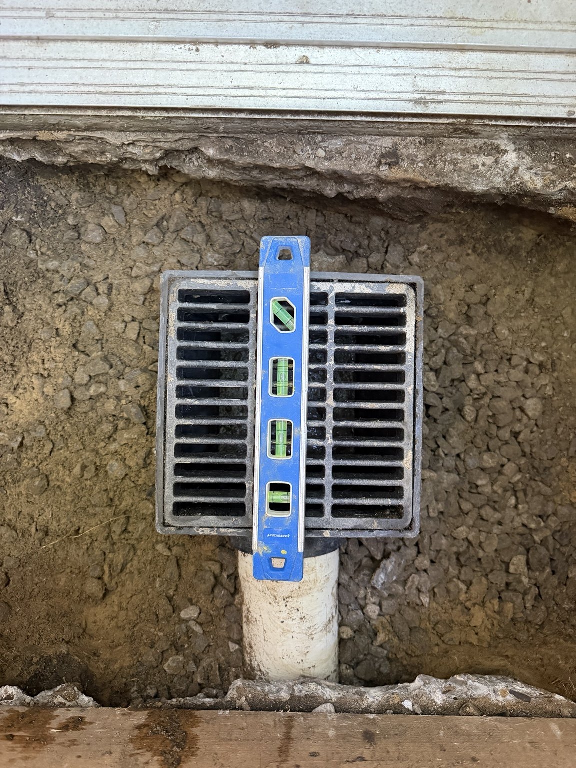 Drain grate level checked