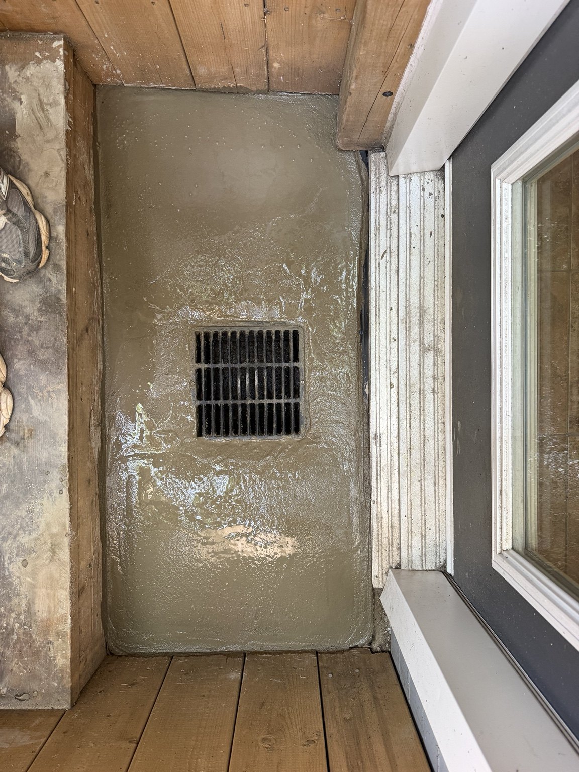 Freshly placed concrete around the drain
