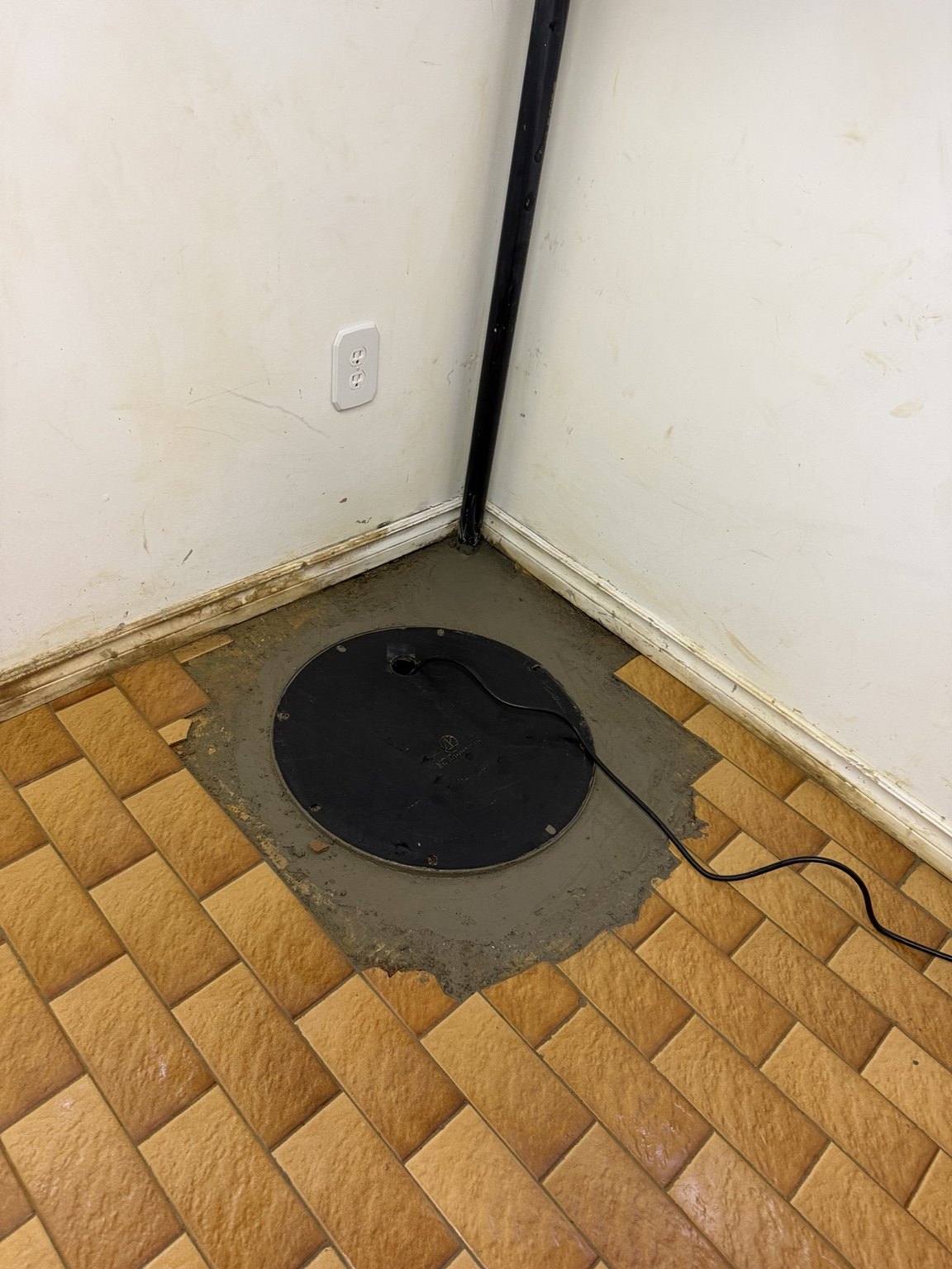 Sump basin lid with restored concrete and discharge piping