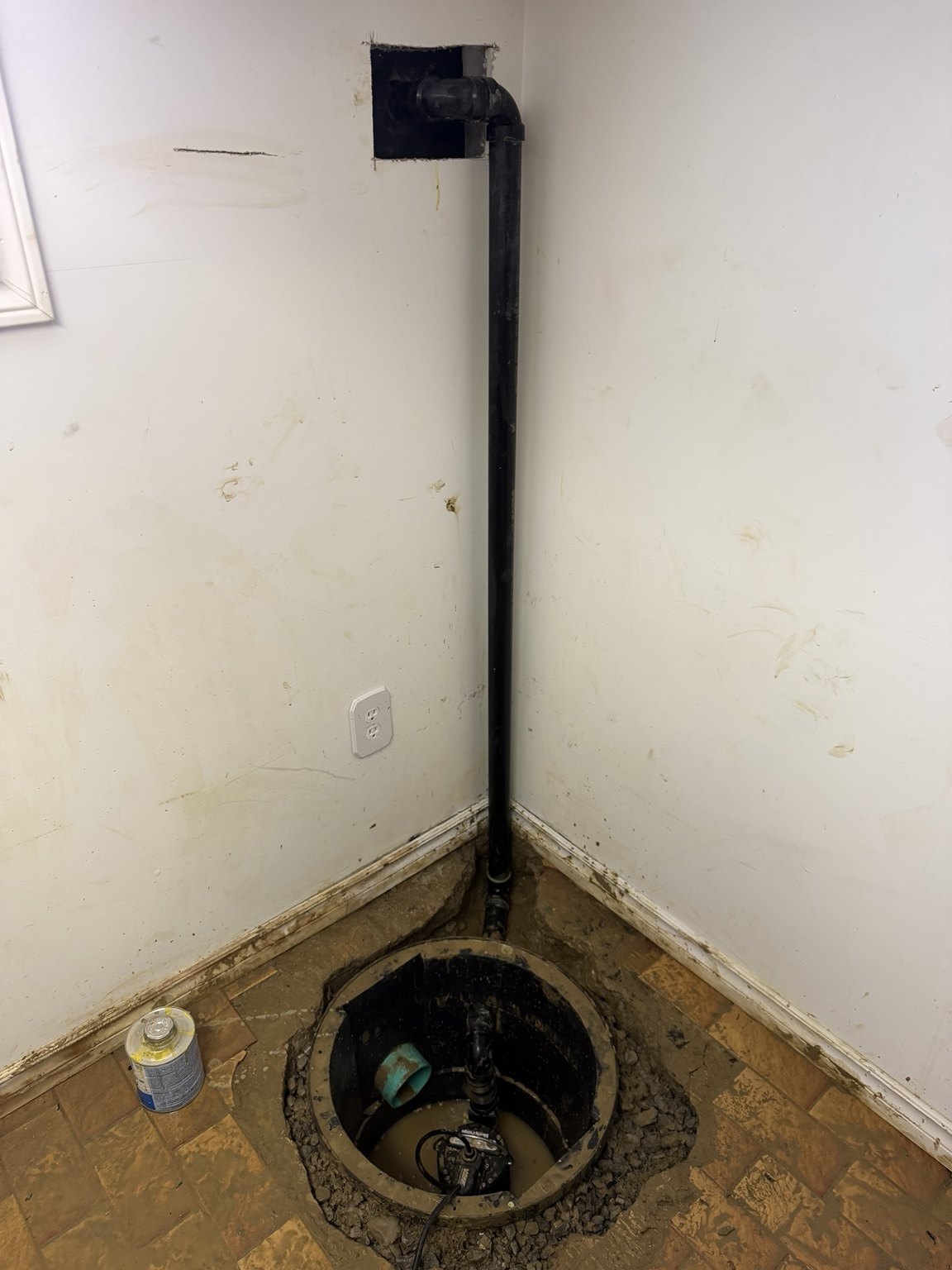 Discharge piping routed up the wall